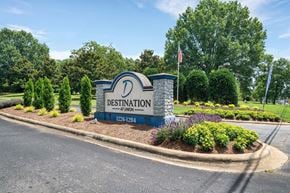 Gastonia apartment for rent - the sign fordestination dentistry at the entrance to the park