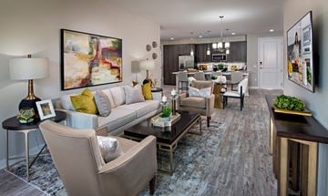 Phoenix apartment for rent - A living room with a grey sofa and a coffee table.
