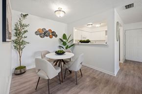 Stuart apartment for rent - A dining room with a white table and chairs.