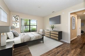 Port Saint Lucie apartment for rent - a bedroom with a large bed and a tv in a room