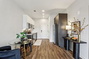 Nashville apartment for rent - A modern kitchen with a glass table and chairs.