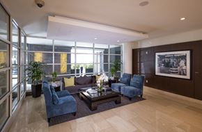 Washington apartment for rent - A living room with a large window and a coffee table.