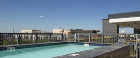 Washington apartment for rent - A pool with a blue tinted water with a white sign on the pool.