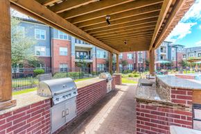 Katy apartment for rent - A patio with a grill and a BBQ box.