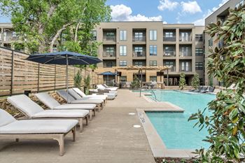 Resort-inspired pool with tanning deck