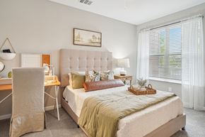 Lebanon apartment for rent - A bedroom with a bed, desk, chair, and window.
