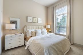 Atlanta apartment for rent - a bedroom with a large bed and a window