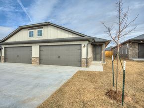 Oklahoma City triplex for rent - a home with a gray garage door