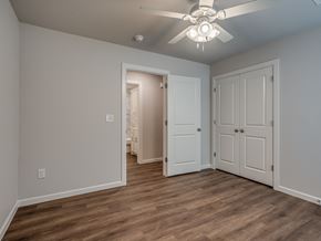 Oklahoma City triplex for rent - a bedroom with a ceiling fan