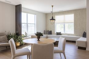 Omaha apartment for rent - A modern dining room with a round table and chairs.