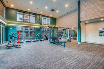 24-Hour fitness center with high-performance technogym equipment, yoga & spin studio