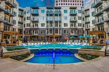 Resort-style bi-level pool with cabana daybeds