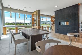 Plano apartment for rent - A modern dining room with a wooden table and chairs.