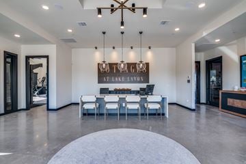 Lavon apartment for rent - A modern dining room with a large table and chairs.