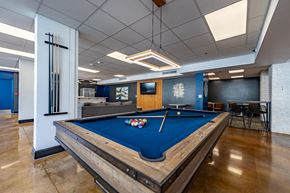 Winston Salem apartment for rent - a billiards table in a room with a blue pool table