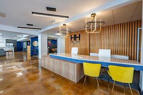 Winston Salem apartment for rent - a conference room with a blue counter and yellow chairs