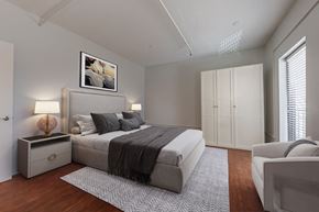 Winston Salem apartment for rent - a bedroom with a large bed and a white couch