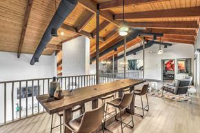 Las Vegas apartment for rent - a dining room with a long wooden table and chairs