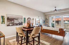 Panama City Beach apartment for rent - A dining room with a table and chairs and a picture on the wall.