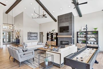 Orland Park apartment for rent - A modern living room with a pool table and a fireplace.