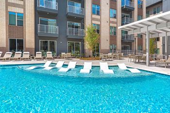Swimming pool with tanning deck