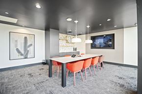 Scottsdale apartment for rent - A conference room with a long table and chairs.