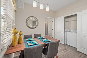 Fort Myers apartment for rent - a dining room with a table and chairs and a mirror