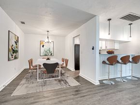Oklahoma City apartment for rent - A dining room with a white table and chairs.