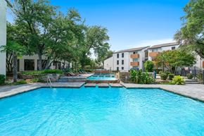 Dallas apartment for rent - Tides at Esperanza community pool and hot tub with apartment buildings in the background