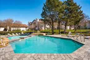 Fort Worth apartment for rent - the swimming pool at the preserve at ballantyne commons apartments
