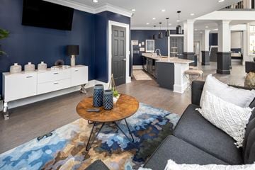 Lithonia apartment for rent - A living room with a grey couch and a wooden coffee table.