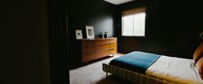 Nashville apartment for rent - a bedroom with a bed and a dresser and a window