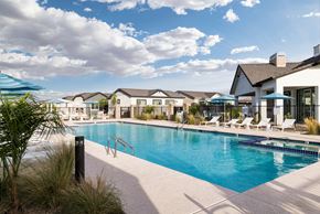 Casa Grande apartment for rent - a swimming pool with chairs and umbrellas at the resort on a sunny day