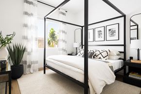 Casa Grande apartment for rent - a bedroom with a bed and a black canopy bed