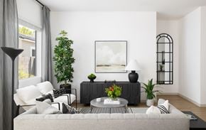Elkhorn townhouse for rent - A living room with a grey couch, a coffee table, and a painting on the wall.