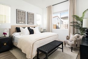 Casa Grande apartment for rent - A bedroom with a large bed, a chair, and a potted plant.