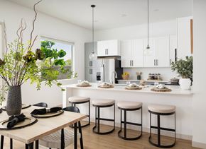 Phoenix apartment for rent - A modern kitchen with a dining table set for two.