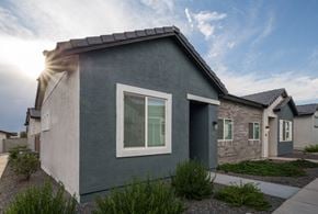 Queen Creek apartment for rent - A modern house with a grey exterior and a large window on the front.