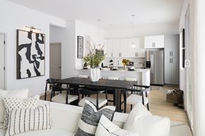 Surprise apartment for rent - A modern dining room with a black table and chairs.