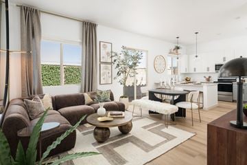 Buckeye apartment for rent - A modern living room with a brown sofa and a coffee table.