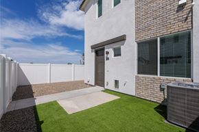 Phoenix apartment for rent - A modern house with a white exterior and a brown brick wall.