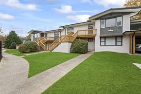Durham apartment for rent - the front of a house with a yard and a staircase