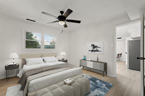Durham apartment for rent - a bedroom with a large bed and a ceiling fan