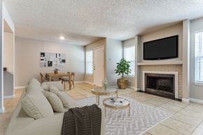 Arlington apartment for rent - A living room with a couch, coffee table, and fireplace.