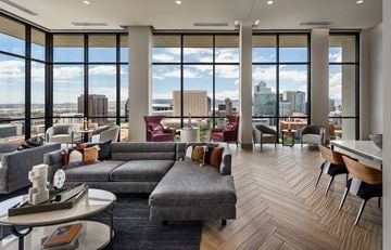 Phoenix apartment for rent - A living room with a grey couch and a coffee table.