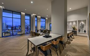 Phoenix apartment for rent - A conference room with a long table and chairs.