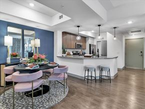 Las Vegas apartment for rent - A modern kitchen with a dining table set for four.