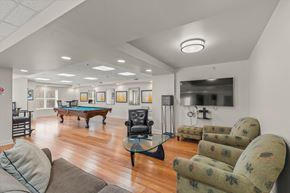 Grayslake apartment for rent - a game room with a pool table and couches