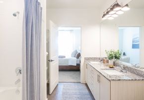 Summerville apartment for rent - a bathroom with a shower and a sink and a bedroom with a bed