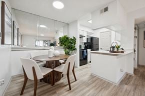 Austin apartment for rent - A modern kitchen with a dining table and chairs.